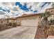 Two-car garage and neutral exterior at 9071 Ravenhurst St, Las Vegas, NV 89123