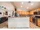 Bright kitchen with wooden cabinets, granite countertops, and stainless steel appliances at 9071 Ravenhurst St, Las Vegas, NV 89123