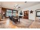 Spacious living room featuring plush seating, a ceiling fan, and a built-in bookcase at 9071 Ravenhurst St, Las Vegas, NV 89123