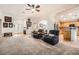 Inviting living room open to the kitchen, featuring comfortable seating and ample natural light at 9071 Ravenhurst St, Las Vegas, NV 89123