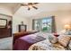 Comfortable main bedroom featuring ample light, soft carpet and tasteful decor at 9071 Ravenhurst St, Las Vegas, NV 89123