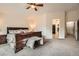 Large main bedroom with neutral walls, soft carpet and a ceiling fan, leading to a walk-in closet at 9071 Ravenhurst St, Las Vegas, NV 89123