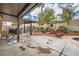 Covered patio with ample space for lounging and dining, complete with outdoor furniture, grill, and view of yard at 9071 Ravenhurst St, Las Vegas, NV 89123