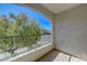 Relaxing balcony with a view of lush trees and clear blue sky at 950 Seven Hills Dr # 722, Henderson, NV 89052