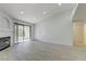 Living room with a fireplace, balcony, and modern flooring at 950 Seven Hills Dr # 722, Henderson, NV 89052