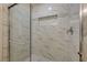 Modern shower features glass door, stylish tile, and built-in niche at 950 Seven Hills Dr # 722, Henderson, NV 89052