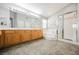 Bathroom with a large vanity, tub, and glass shower at 9725 La Cienega St, Las Vegas, NV 89183