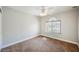 Bright bedroom with neutral carpet, ceiling fan, and natural light from the window at 9725 La Cienega St, Las Vegas, NV 89183