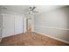 Comfortable bedroom with neutral carpet, closet, and a ceiling fan at 9725 La Cienega St, Las Vegas, NV 89183