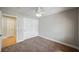 Comfortable bedroom with neutral carpet, closet, and a ceiling fan at 9725 La Cienega St, Las Vegas, NV 89183