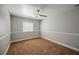 Simple bedroom featuring neutral carpet, a single window, and a ceiling fan at 9725 La Cienega St, Las Vegas, NV 89183