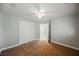 Bright bedroom with plush carpet, featuring a double door closet and an open doorway at 9725 La Cienega St, Las Vegas, NV 89183