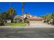 Inviting single-story home with desert landscaping and an attached three-car garage at 9725 La Cienega St, Las Vegas, NV 89183