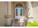 Charming front entrance with a decorative gate and white-framed glass doors at 9725 La Cienega St, Las Vegas, NV 89183