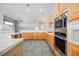 Kitchen featuring wood cabinets, stainless steel appliances and marble countertops at 9725 La Cienega St, Las Vegas, NV 89183