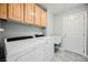 Laundry room features a washer, dryer, and a wash basin at 9725 La Cienega St, Las Vegas, NV 89183