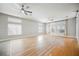 Open concept living room with hardwood floors, lots of natural light and ceiling fans at 9725 La Cienega St, Las Vegas, NV 89183