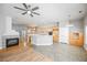 Living area featuring tile and hardwood flooring, fireplace, and open kitchen at 9725 La Cienega St, Las Vegas, NV 89183