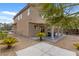 A landscaped backyard features a covered patio, desert landscaping, and privacy fence at 9792 Valmeyer Ave, Las Vegas, NV 89148