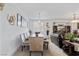 Open-concept dining area featuring tile floors and stylish furnishings at 9792 Valmeyer Ave, Las Vegas, NV 89148