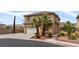 Two-story home featuring a two-car garage, desert landscaping and tile roof at 9792 Valmeyer Ave, Las Vegas, NV 89148