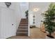 Welcoming foyer showcases a staircase, tile flooring, and a stylish entryway, creating a warm first impression at 9792 Valmeyer Ave, Las Vegas, NV 89148