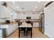 Bright kitchen with white cabinets, stainless steel appliances, and a center island at 9792 Valmeyer Ave, Las Vegas, NV 89148