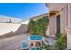 Charming back patio featuring a custom tiled table and serene outdoor space at , Las Vegas, NV 89138