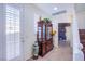 Inviting entryway features a decorative cabinet, tile flooring, and a view of a stone-accented wall at , Las Vegas, NV 89138