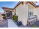 Elegant home entrance with stone accents and wrought iron gate detail at , Las Vegas, NV 89138