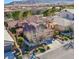 Stunning two-story home with a red tile roof, desert landscaping, and mountain views at , Las Vegas, NV 89138