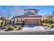 Charming two-story home featuring a well-manicured front yard with lush landscaping at , Las Vegas, NV 89138