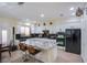 Bright kitchen with white cabinetry, stainless steel appliances, and a granite island at 11773 Golden Moments Ave, Las Vegas, NV 89138