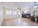 Spacious living room with a fireplace, tile flooring, and natural light at 11773 Golden Moments Ave, Las Vegas, NV 89138