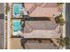 Aerial view showcasing a backyard with a pool and spa, patio furniture and desert landscaping at 10052 Silver Comet Ct, Las Vegas, NV 89178