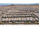 Expansive aerial view of a residential community nestled in a desert landscape at 10052 Silver Comet Ct, Las Vegas, NV 89178