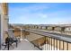 Enjoy the neighborhood view from this cozy balcony with seating, perfect for morning coffee at 10052 Silver Comet Ct, Las Vegas, NV 89178