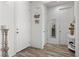 The entryway showcases stylish wood-look floors, multiple doors, and a welcoming atmosphere at 10052 Silver Comet Ct, Las Vegas, NV 89178
