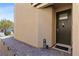 Inviting home entrance featuring a stylish door, welcome mat, and brick walkway at 10052 Silver Comet Ct, Las Vegas, NV 89178