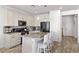 Well-equipped kitchen with a central island, sleek appliances, and ample cabinet space for culinary enthusiasts at 10052 Silver Comet Ct, Las Vegas, NV 89178