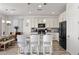 Open kitchen featuring granite countertops, stainless steel appliances, and island seating at 10052 Silver Comet Ct, Las Vegas, NV 89178