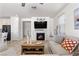 Cozy living room with a fireplace, neutral decor, and hardwood style flooring at 10052 Silver Comet Ct, Las Vegas, NV 89178