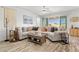 This comfortable living room is decorated with a sectional sofa, a decorative rug, and natural light at 10052 Silver Comet Ct, Las Vegas, NV 89178