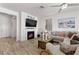 Cozy living room featuring a fireplace, comfortable sofa, and stylish decor for a warm and inviting atmosphere at 10052 Silver Comet Ct, Las Vegas, NV 89178