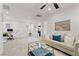 This is a spacious living room with neutral decor, lots of light, and modern touches at 10052 Silver Comet Ct, Las Vegas, NV 89178