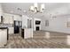 This open-concept area seamlessly connects the kitchen and living spaces for a modern and airy feel at 10052 Silver Comet Ct, Las Vegas, NV 89178