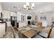 This open-concept area connects the kitchen, dining, and living spaces, ideal for modern living and entertaining at 10052 Silver Comet Ct, Las Vegas, NV 89178