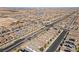 Expansive residential neighborhood showing an intersection with numerous homes and desert landscape at 10052 Silver Comet Ct, Las Vegas, NV 89178