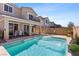 Beautiful pool and backyard with patio and water features at 10052 Silver Comet Ct, Las Vegas, NV 89178