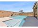 Inviting pool area with desert landscaping and serene water feature at 10052 Silver Comet Ct, Las Vegas, NV 89178
